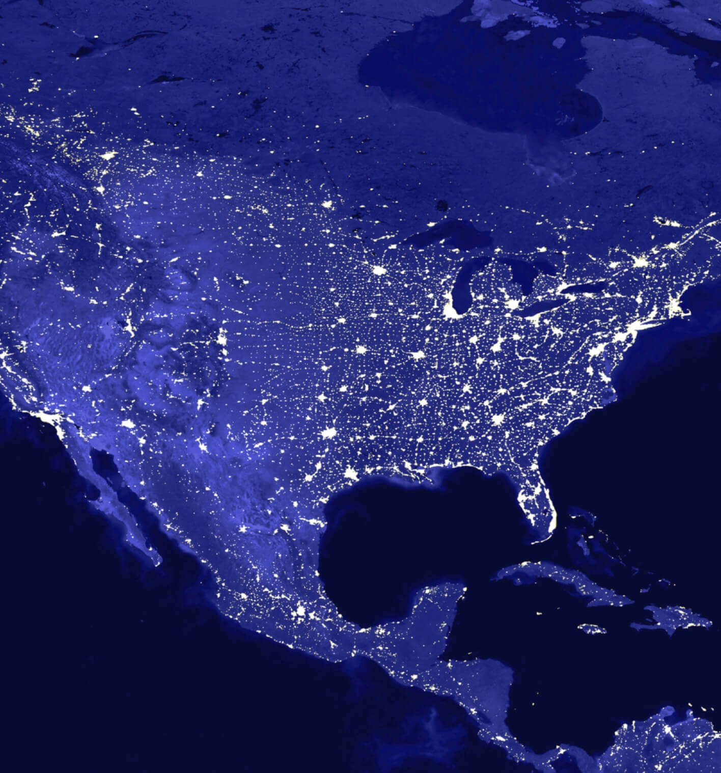 Map of the United States as shown by illuminated electrical lights on a dark blue background.