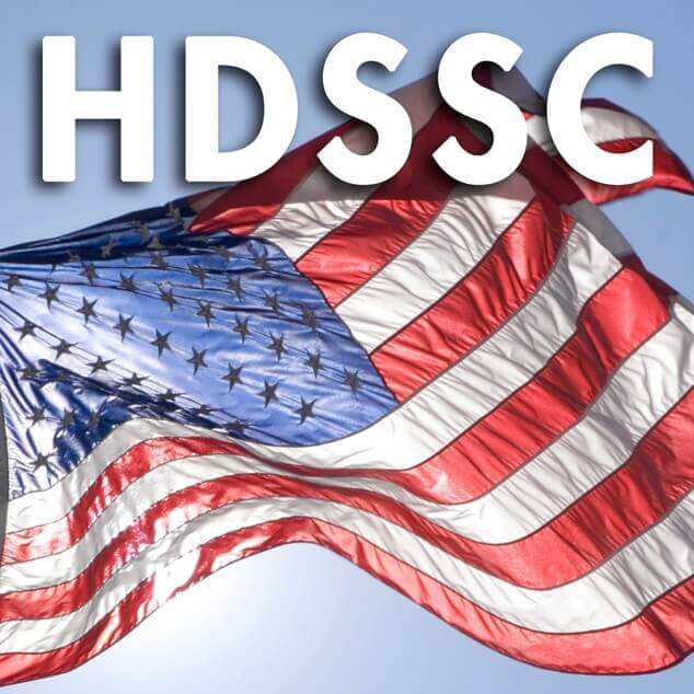 ANSI HDSSC logo with American flag flying against a blue sky.
