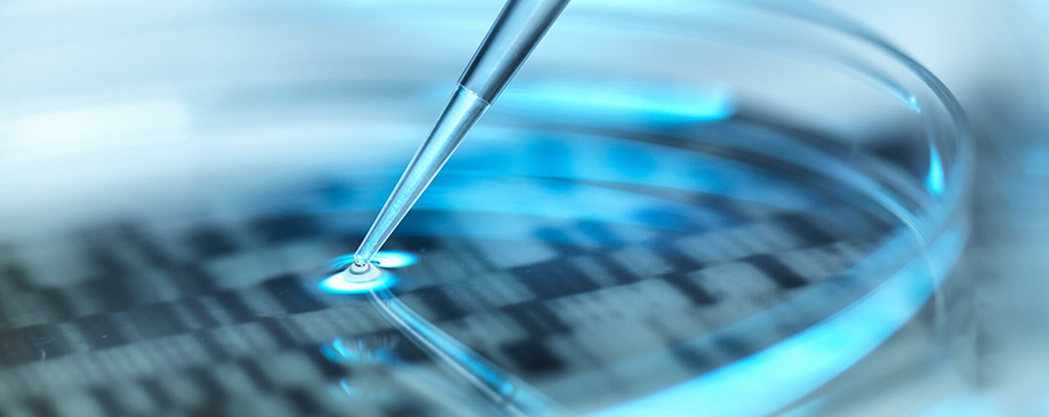 Closeup of a DNA lab side with liquid dropper