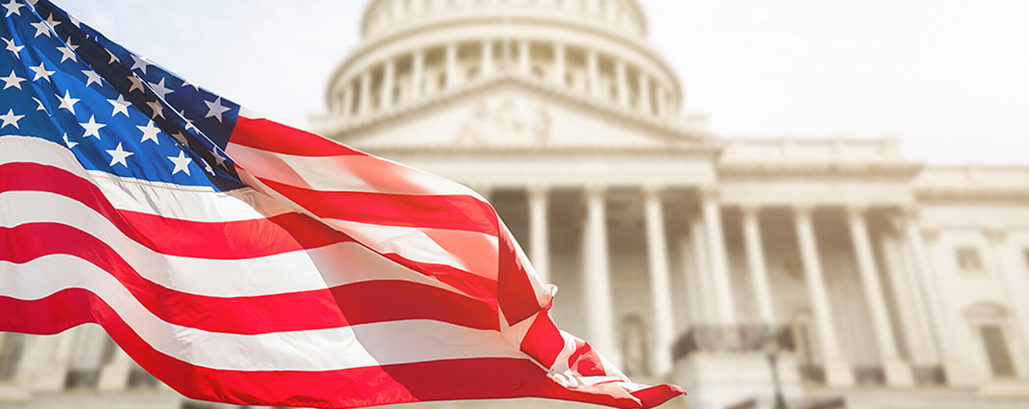 US flag in front of government buildings