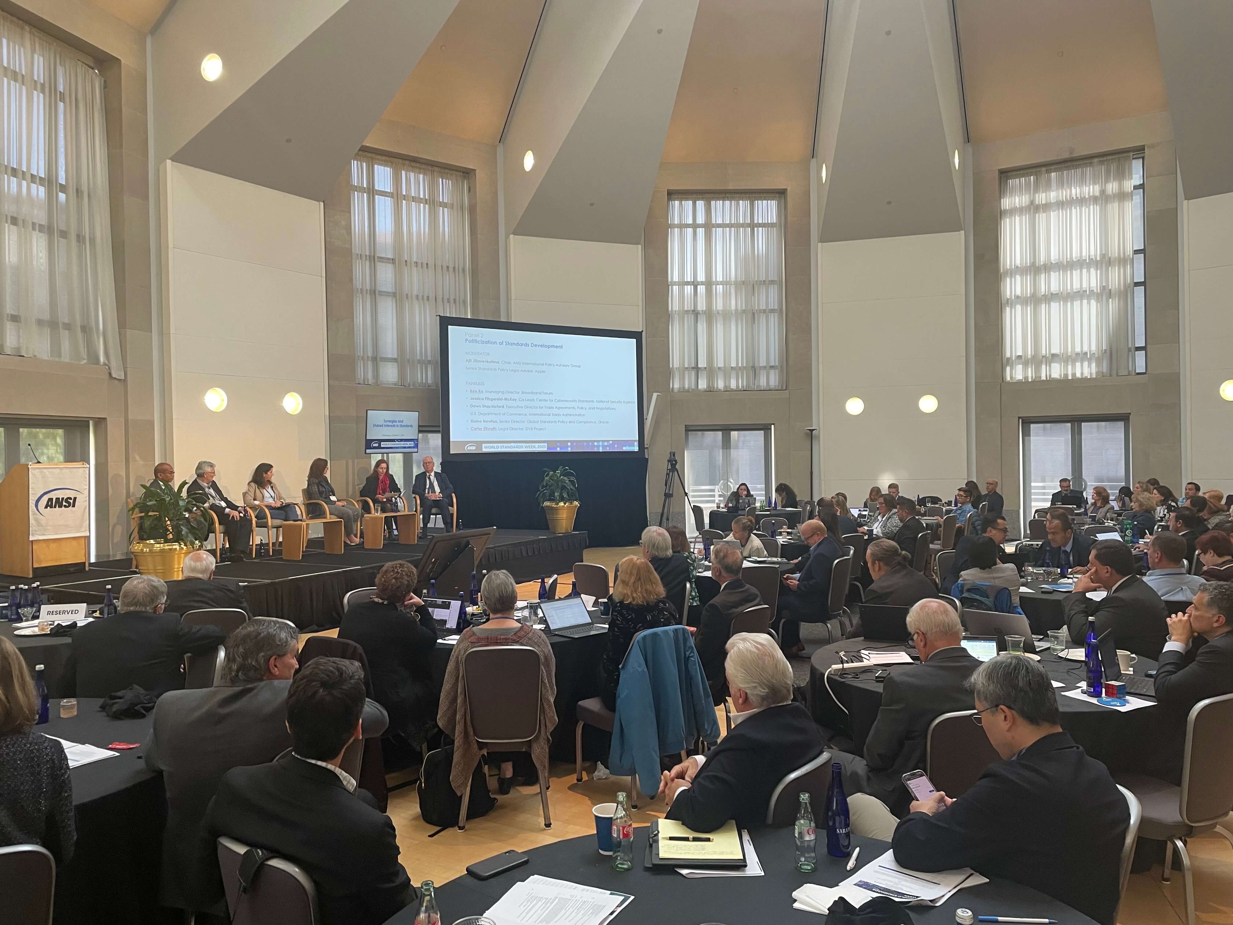 Conference room with panelists and attendees