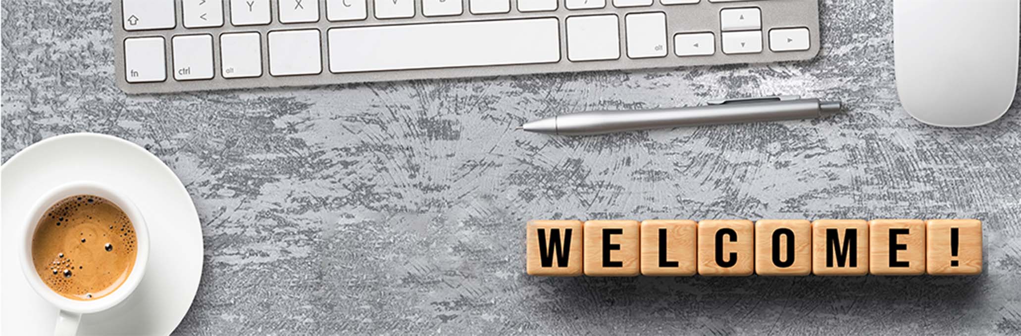Welcome sign on a desk
