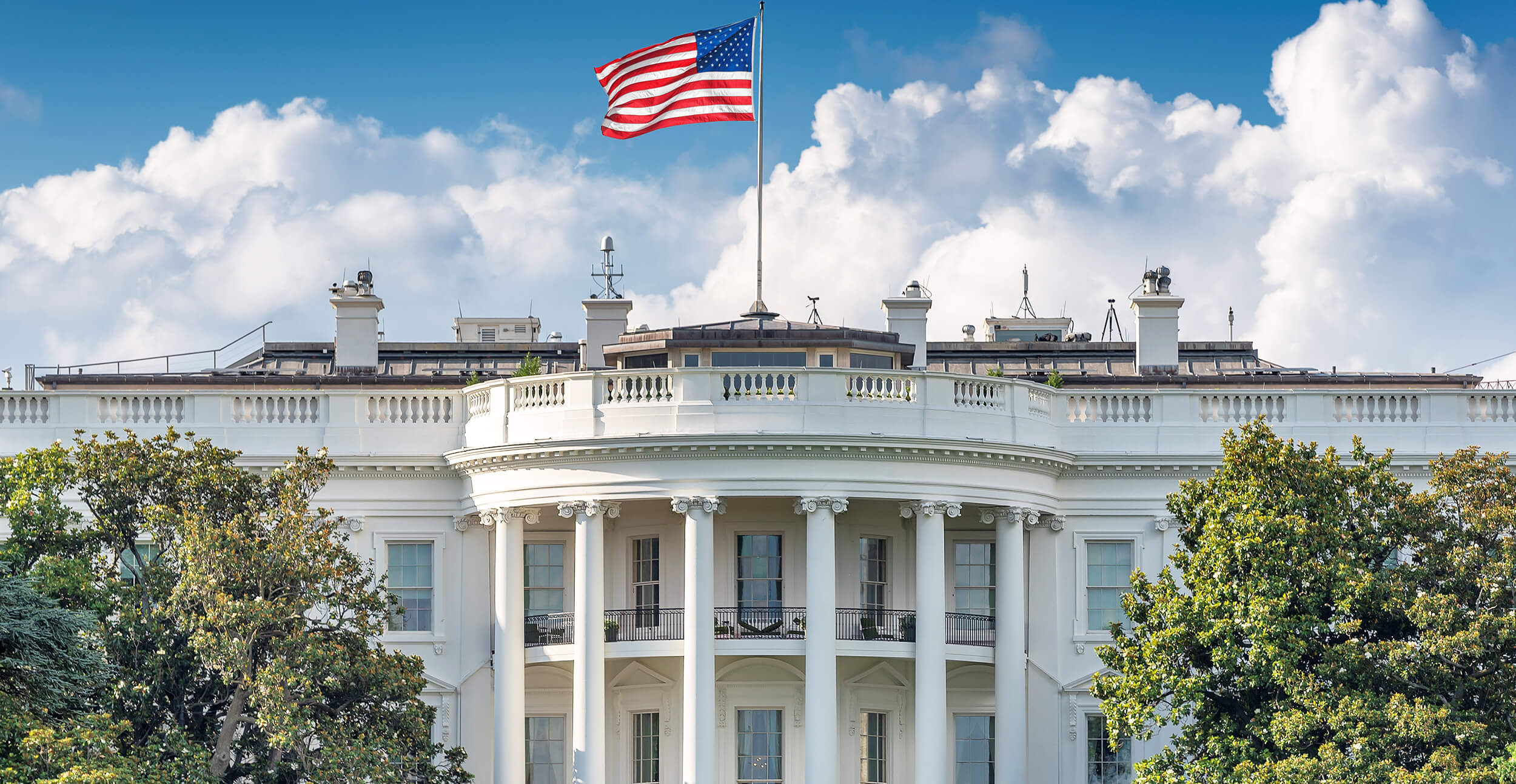 U.S. White house with a blue sky.
